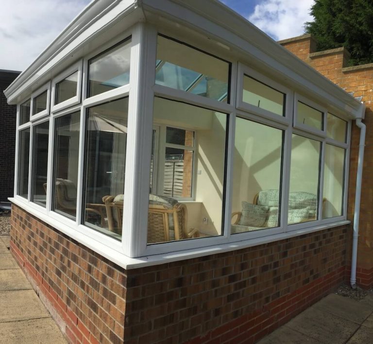 White PVC-u solid roof of Georgian style conservatory