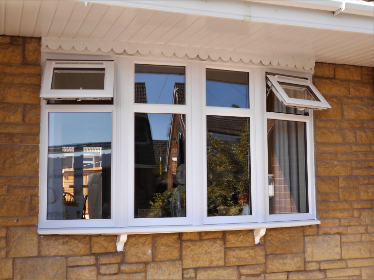 A PVC-u Bow window in White