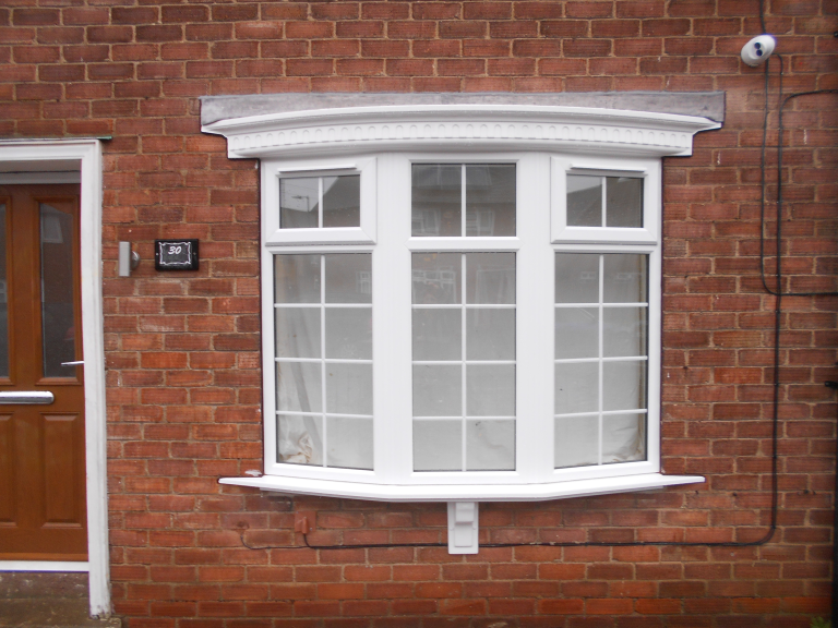 A PVC-u Bow Window in White with Georgian styled glass